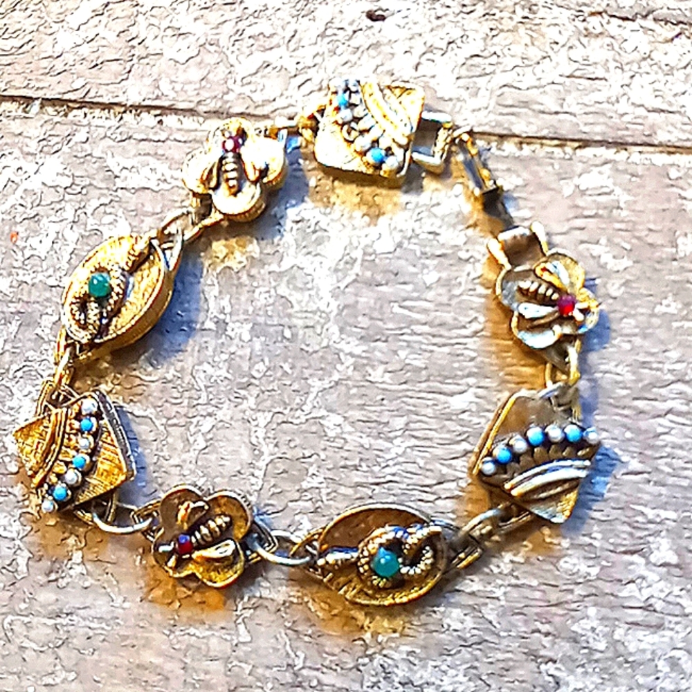 - Vintage gold charm bracelet with gems